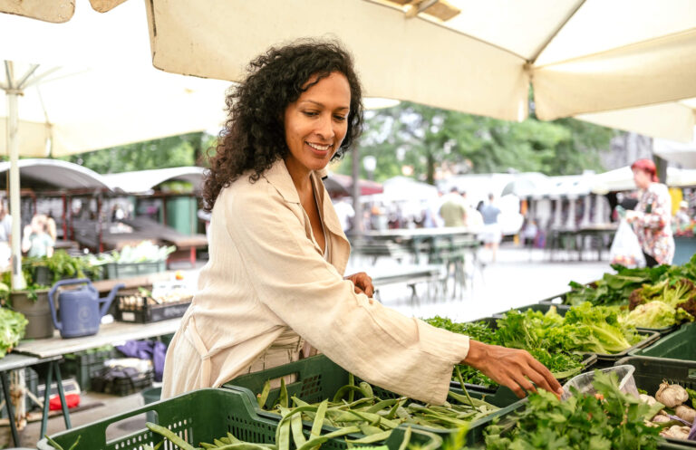 Woman shopping for produce.